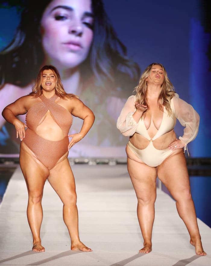 Hunter McGrady and sister Michaela McGrady walk the runway for Sports Illustrated Swimsuit Runway Show During Paraiso Miami Beach on July 16, 2022 in Miami Beach, Florida.